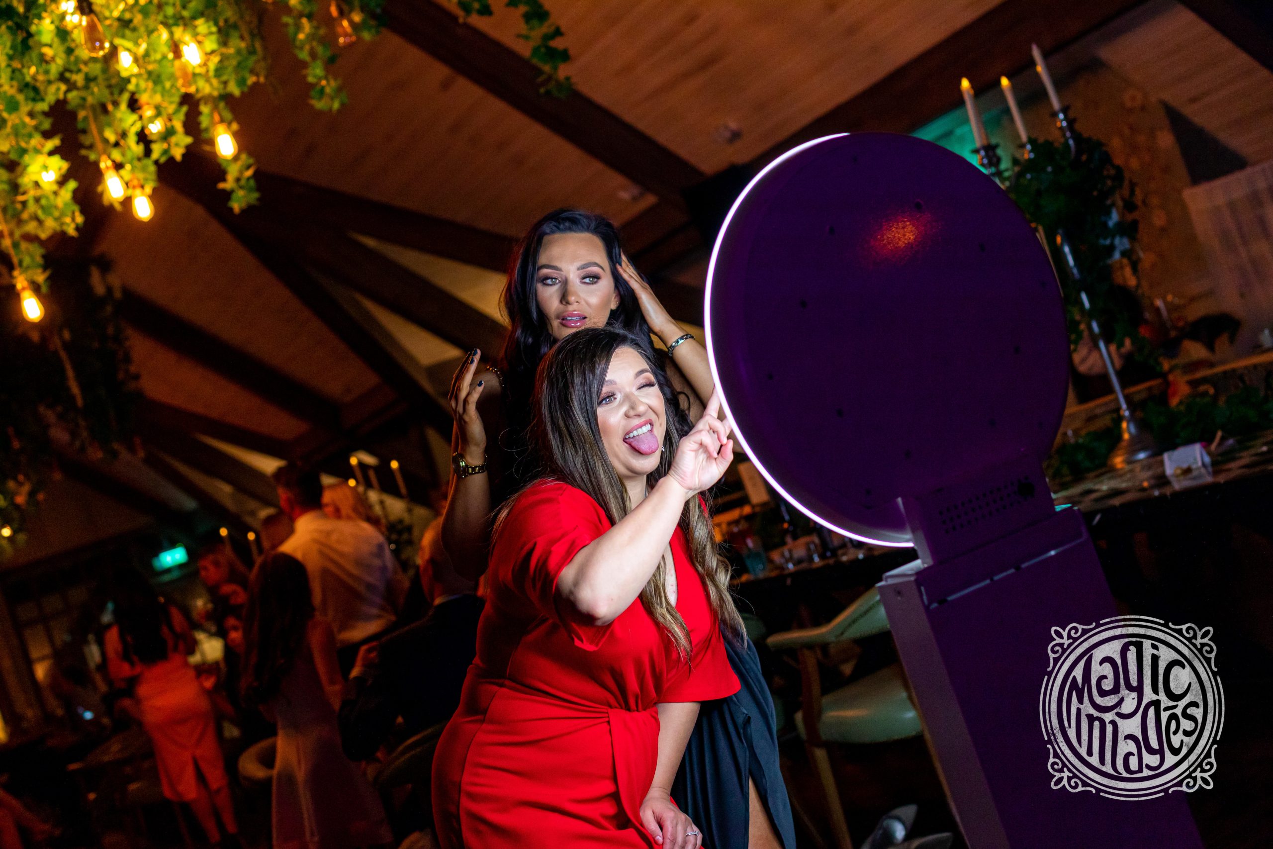 Photo booth being used by two ladies